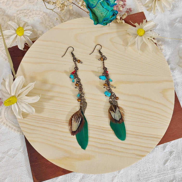 lush elemental emerald feather earrings