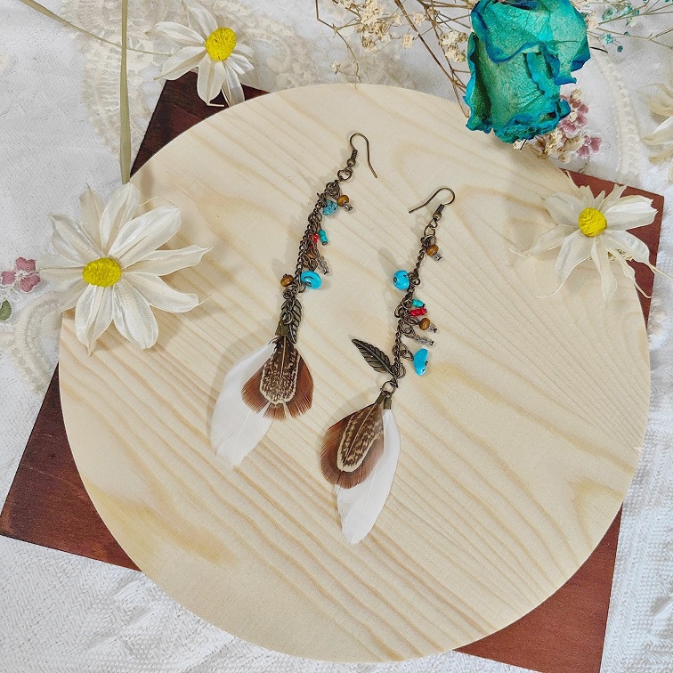 lush elemental white feather earrings