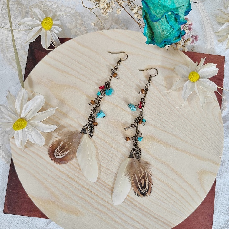 lush elemental ivory feather earrings