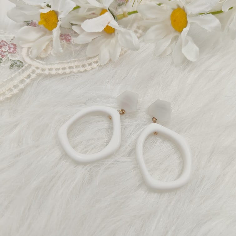 white cutout geometric earrings
